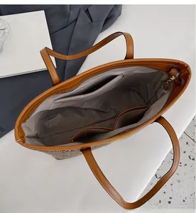 Interior view of large tote bag showing zipper pocket and spacious compartments