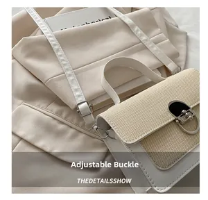Detail of adjustable buckle and strap on contrast leather and straw shoulder bag