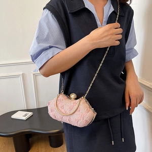 Elegant pink floral lace evening bag with pearl clasp and golden chain strap