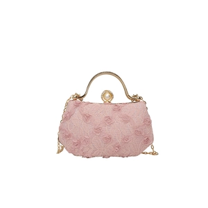Pink lace evening clutch bag with 3D floral textures and elegant gold pearl handle