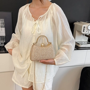 Elegant champagne gold evening clutch with sequins, pearl clasp and metal ring handle