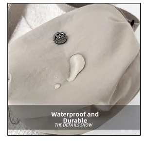Close-up of waterproof nylon fabric with water droplets and M FASHION metal logo plate