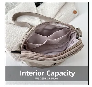 Detail view of the lightweight nylon crossbody bag showing multiple inner compartments