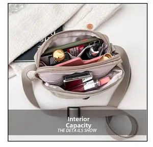 Close-up of nylon crossbody bag interior showing spacious compartments for cosmetics and phone