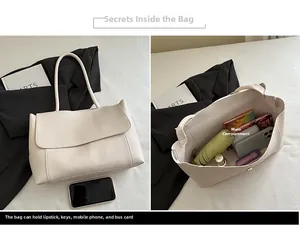 Detail view of large beige tote bag interior capacity with everyday essentials