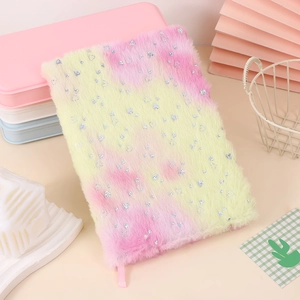 Fuzzy plush notebook with pink and yellow gradient fur and silver heart sequins