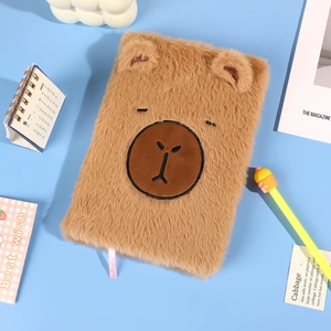 Cute brown plush bear notebook with 3D ears on a fresh blue background