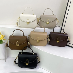 Retro shoulder bag with gold oval lock in white, khaki, caramel, and black colors