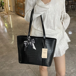 Large black crocodile pattern tote bag with decorative scarf and elegant shoulder straps