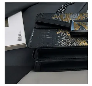 Close-up of gloss snake pattern leather texture and precise stitching on the crossbody bag