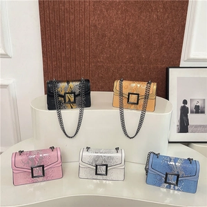 Fashionable snakeskin crossbody bags with metal chains in five vibrant color options