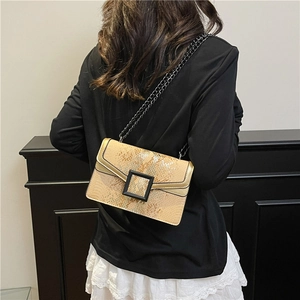 Chic snakeskin chain shoulder bag in golden brown with matte black buckle and chain strap