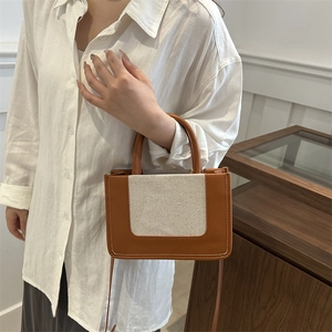 Brown and beige patchwork tote bag with top handles and contrast stitching details