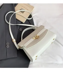 Detail of cream crossbody bag showing contrast between smooth leather and woven texture flap