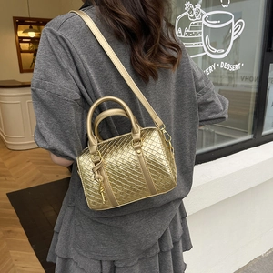Golden woven Boston bag with top handles and adjustable shoulder strap for women