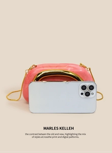 Pink marble acrylic evening bag size comparison with a smartphone and gold chain