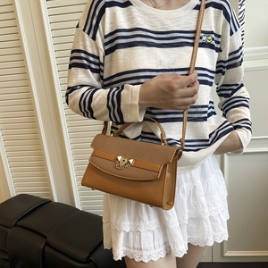 Chic brown woven texture crossbody bag with gold lock for stylish daily commuting