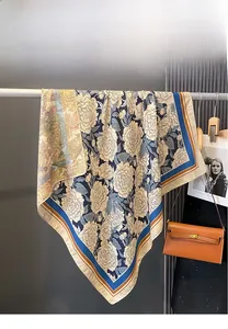 Detailed view of double-sided floral print on silk scarf with premium hemmed edges