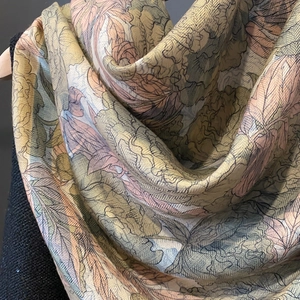 Detailed view of vintage floral print fabric with premium twill texture and smooth drape