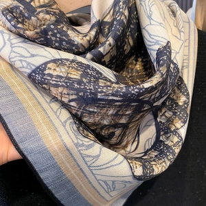 Detailed close-up of premium camellia silk scarf showing herringbone texture and print