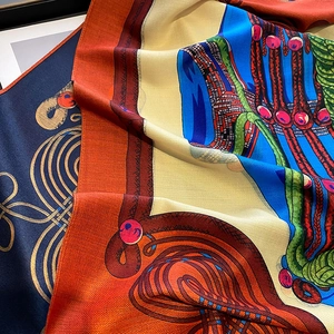 Double-sided printed scarf with artistic herringbone weave pattern and vibrant colors