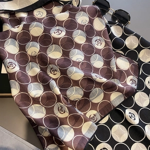 Polka dot camellia pattern square silk scarf in brown and black for sun protection