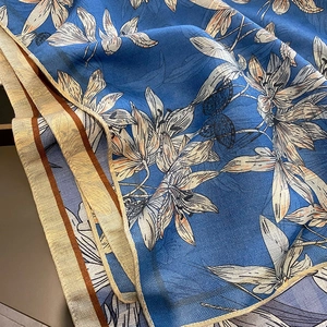 Navy blue silk scarf with cream lily print and elegant herringbone texture weave