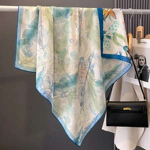 Fresh tropical leaf print silk scarf in mint green and blue for summer beach sun protection