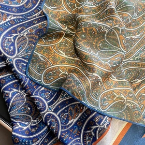 Classic paisley print scarf with silky texture and vibrant geometric patterns