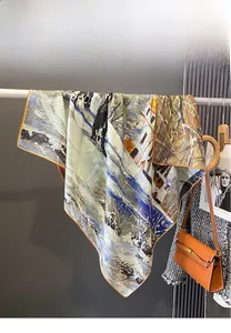 Detail of artistic oil painting print silk square scarf styled with luxury fashion accessories