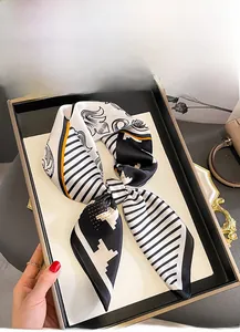 Detail of mulberry silk square scarf with houndstooth print in an elegant gift box