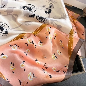 Floral silk square scarf featuring rose and daisy patterns with elegant contrast borders