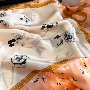 Elegant floral silk satin scarf with coral pink base and black rose hand-drawn patterns