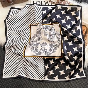 Detail of silk square scarf featuring houndstooth, stripe patterns and vintage prints