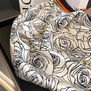 Silk square scarf with rose print and striped borders on a premium satin finish
