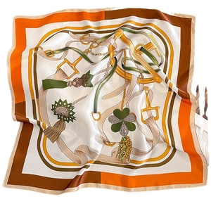 Silk square scarf featuring equestrian stirrup patterns and tassels in orange and brown