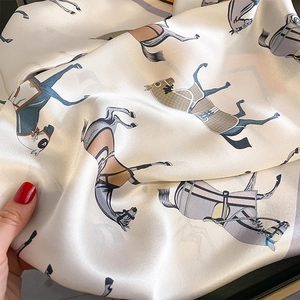 Elegant ivory silk scarf with vintage equestrian horse prints and smooth texture