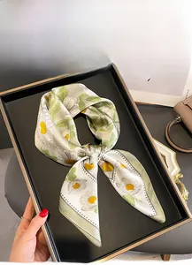 Detail of 100% mulberry silk square scarf with delicate green and white daisy print