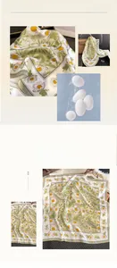 Detail of 100% mulberry silk scarf featuring vintage daisy patterns and sheer texture