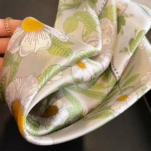 Floral 100% mulberry silk scarf with yellow daisy print and glossy satin texture