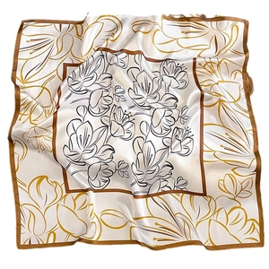 Elegant ivory silk square scarf featuring black and gold floral line art and satin finish