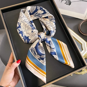 Vintage floral silk scarf with navy blue base and white blossom print in bow tie style