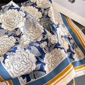 Floral print mulberry silk scarf in navy blue and yellow with smooth satin finish