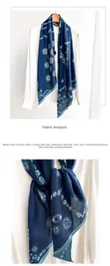 Detail of navy blue bohemian scarf with mandala patterns on a white shirt
