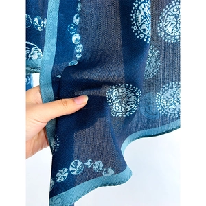 Blue herringbone patterned cotton-linen blend scarf featuring abstract floral prints