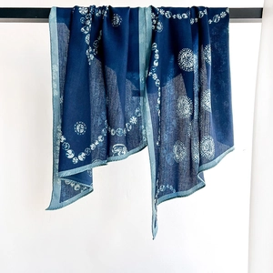 Deep blue long scarf with white circular geometric pattern and light blue edges