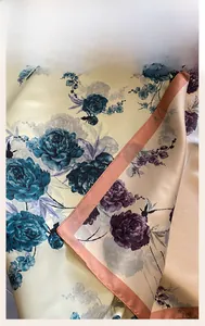Macro view of exquisite retro peony print on silk scarf with fine machine hemmed edge