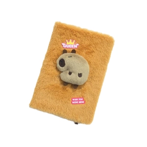 Detail of plush Capybara notebook with 3D doll decoration and Queen crown patch