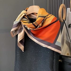 Elegant geometric silk square scarf for women in warm orange and neutral tones