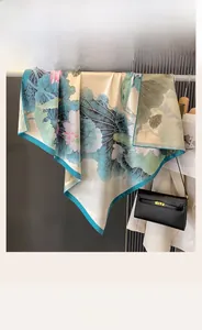 Detail of 90cm square silk scarf with double-sided floral lotus print and soft texture